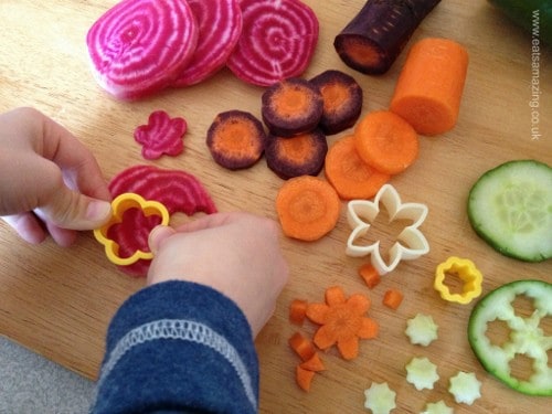 Eats Amazing - Small Child cuts out vegetable flowers for our salad