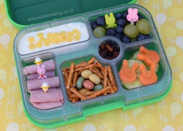 Simple Easter Bento Lunch in the Yumbox with pretzel stick nest from Eats Amazing UK - Fun Food for Kids