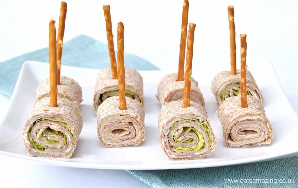 Fun and healthy kids party food idea - cute tortilla roll-up lollipops with edible sticks from Eats Amazing UK