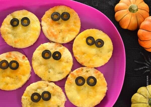 Fun Halloween Party Food - turn garlic pizza bread into ghosty bites with slices of olive
