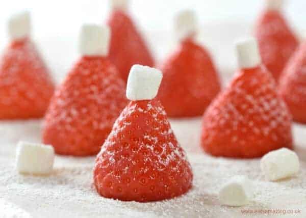Super Easy Christmas Snack Idea - these simple strawberry Santa hats are perfect for party food or a North Pole Breakfast - Eats Amazing