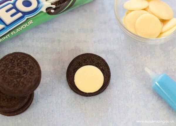 How to make quick and easy Oreo penguins with mint flavour oreos - Step 1 white chocolate buttons