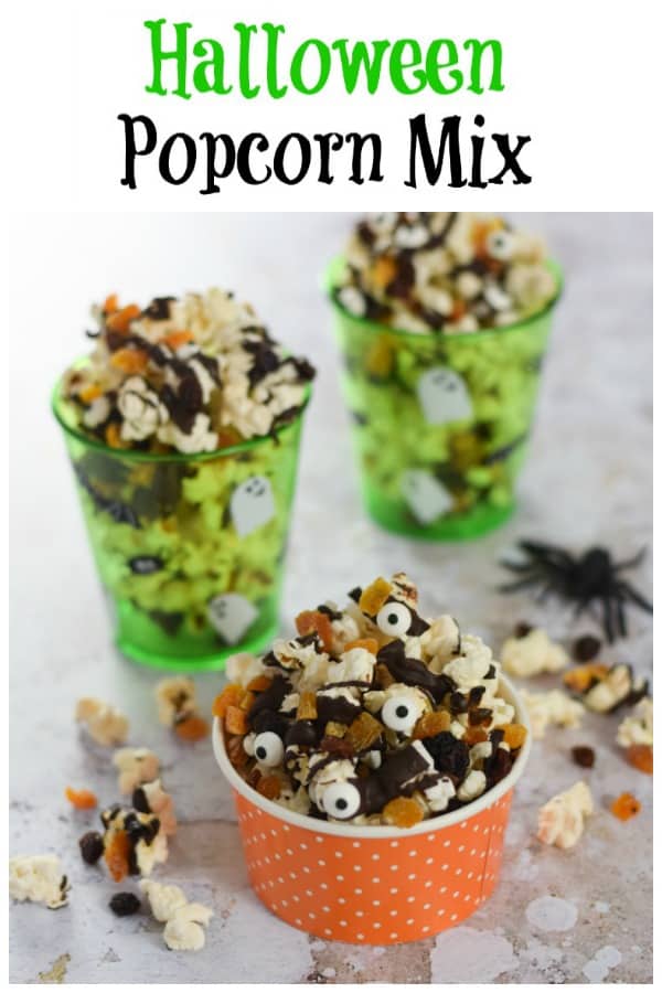 Spooky Halloween popcorn with dark chocolate and edible eyes - fun Halloween food for kids that is great for movie snacks and party food #EatsAmazing #Halloween #HalloweenFood #Halloweenparty #partyfood #halloweenfun #kidsfood #funfood #easyrecipe #halloweenrecipes #movienight #popcorn