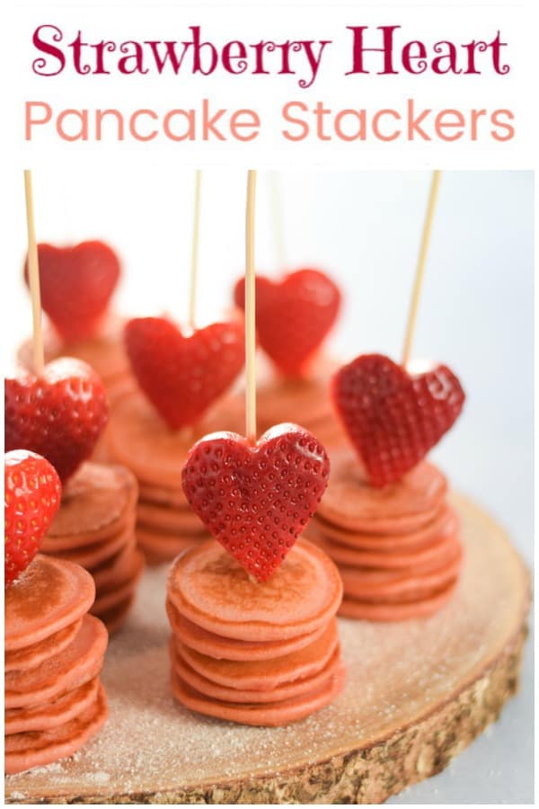 This cute strawberry heart topped mini pancake stackers recipe is perfect for a fun Valentines breakfast for kids #EatsAmazing #valentinesday #valentines #hearts #pancakes #pancakeday #breakfast #breakfastrecipes #kidsfood #foodforkids #healthykids #funfood #cutefood #foodart 
