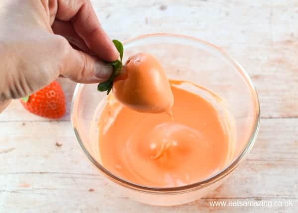 How to make carrot strawberries - step 2 dip the strawberries