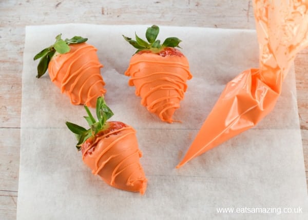 How to make carrot strawberries - step 4 - pipe over lines with leftover candy melts