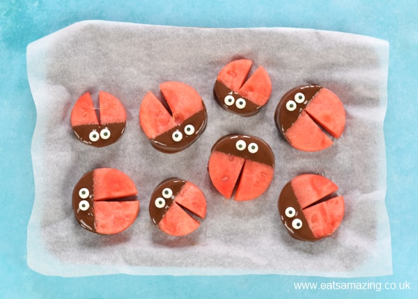 How to make watermelon ladybirds - step 4 add candy eyeballs