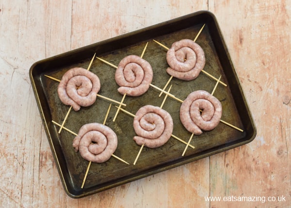 Cumberland sausage swirls on a stick - fun fireworks recipe - Step 5 place on oiled baking tray and cook in the oven