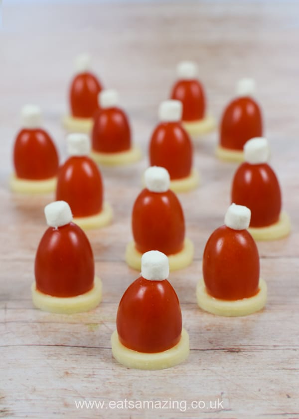 Fun and easy cheese and tomato Santa Hats recipe with video tutorial - fun Christmas party food for kids