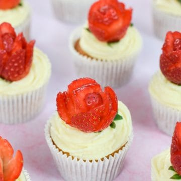 Gorgeous strawberries and cream cupcakes recipe with real strawberry rose decorations - cute dessert for Valentines Day or Mothers Day