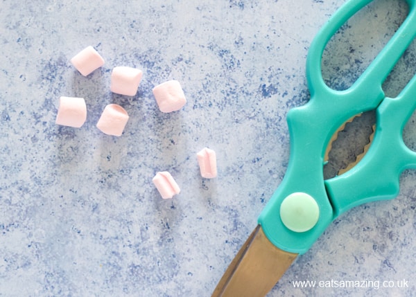 How to make bunny marshmallows - step 2 cut a mini marshmallow in two lengthways with clean kitchen scissors