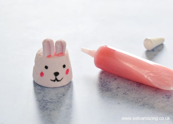 How to make bunny marshmallows - step 3 glue on mini marshmallow ears with writing icing
