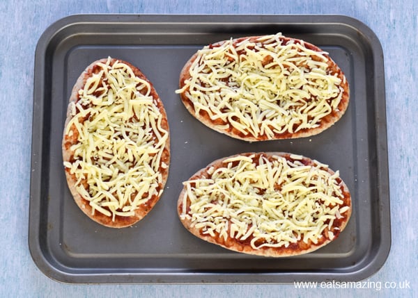 How to make Pitta Pizza Step 3 - add grated cheese