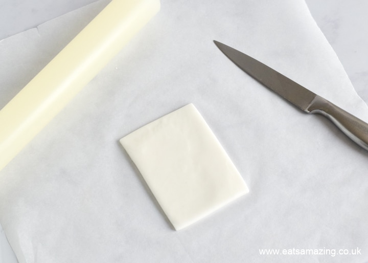 How to make pencil and paper cake decorations - step 1 cut white rectangle for paper